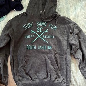 Small, dark gray Folly Beach hoodie. Brand is Pacific and co.